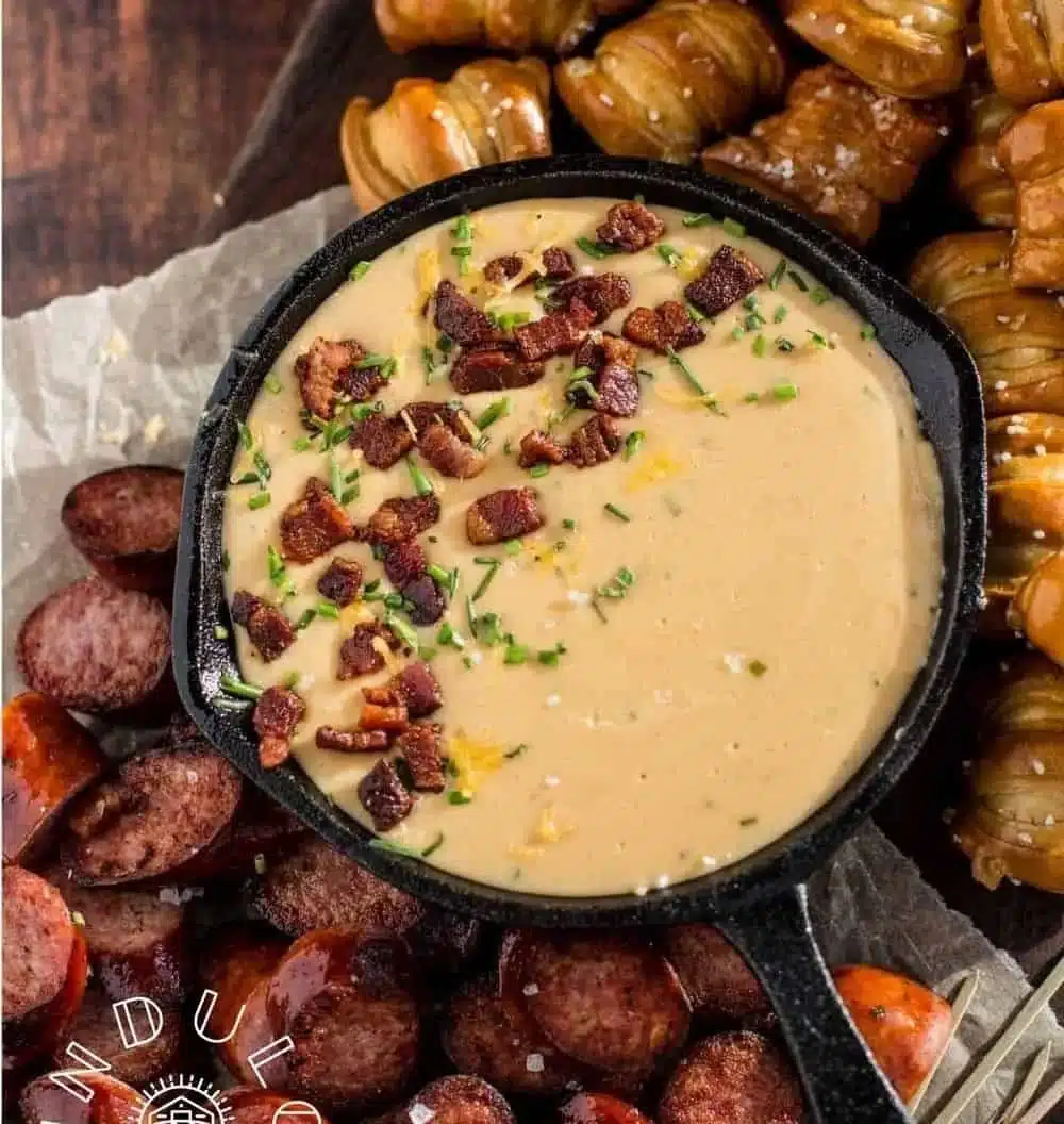 Creamy beer cheese dip served with bread for a game day snack