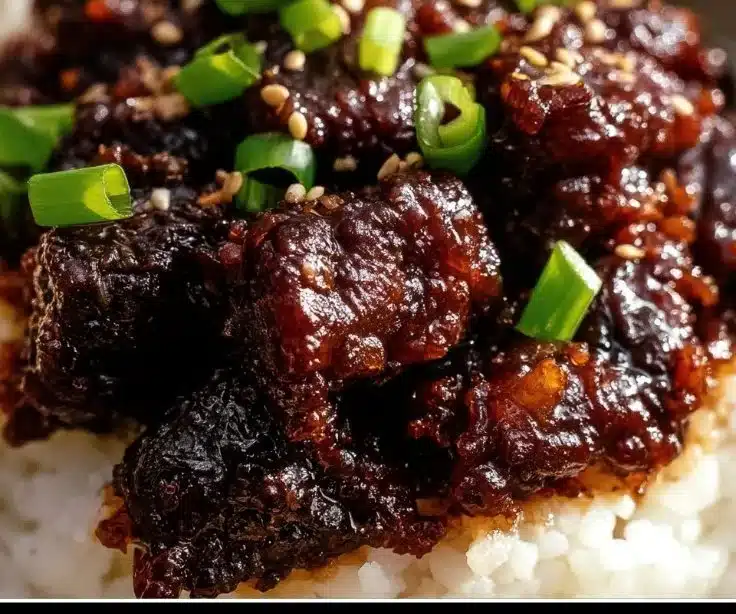 Crispy Honey Garlic Ground Beef Rice Bowl garnished with vegetables.