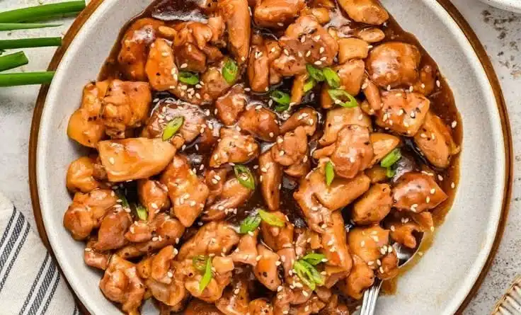 Stir Fried Bourbon Chicken ready to serve, glazed with bourbon sauce and vegetables