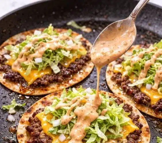 Crispy Big Mac tacos served with special sauce on a plate