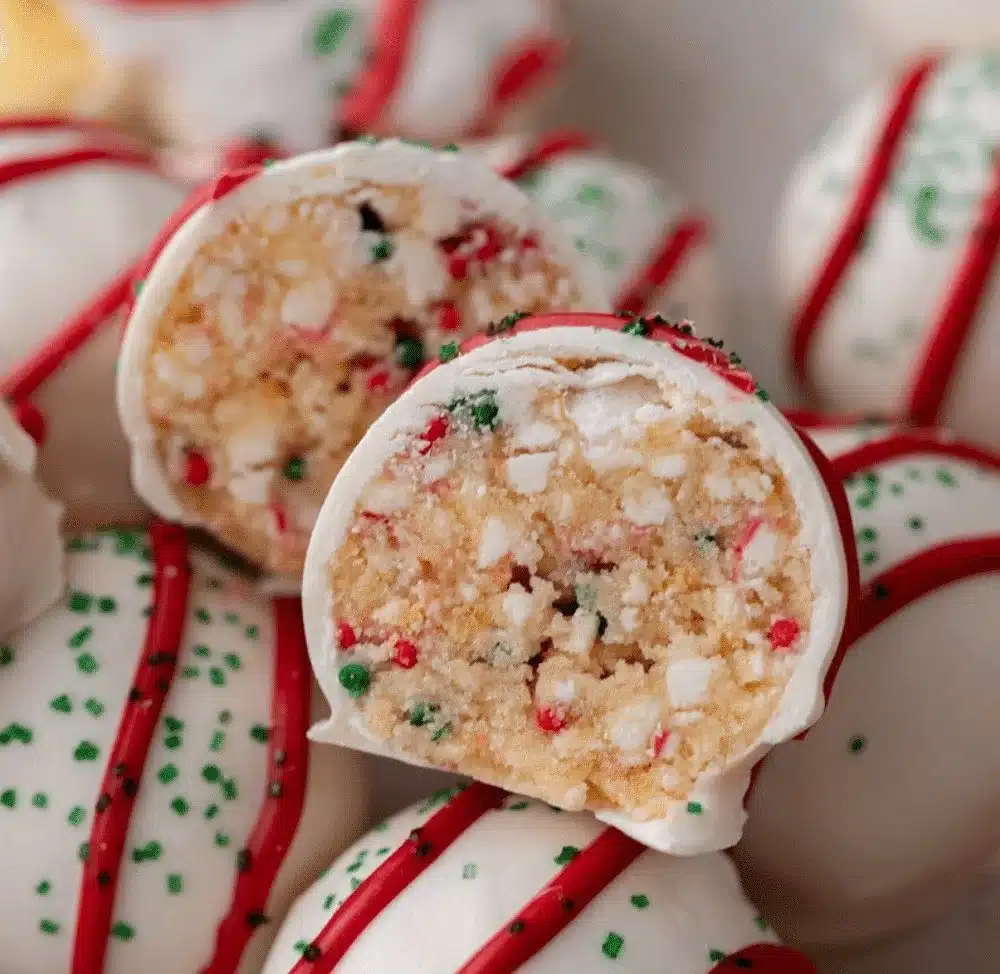 Delicious Christmas tree cake truffles with festive decorations and green frosting
